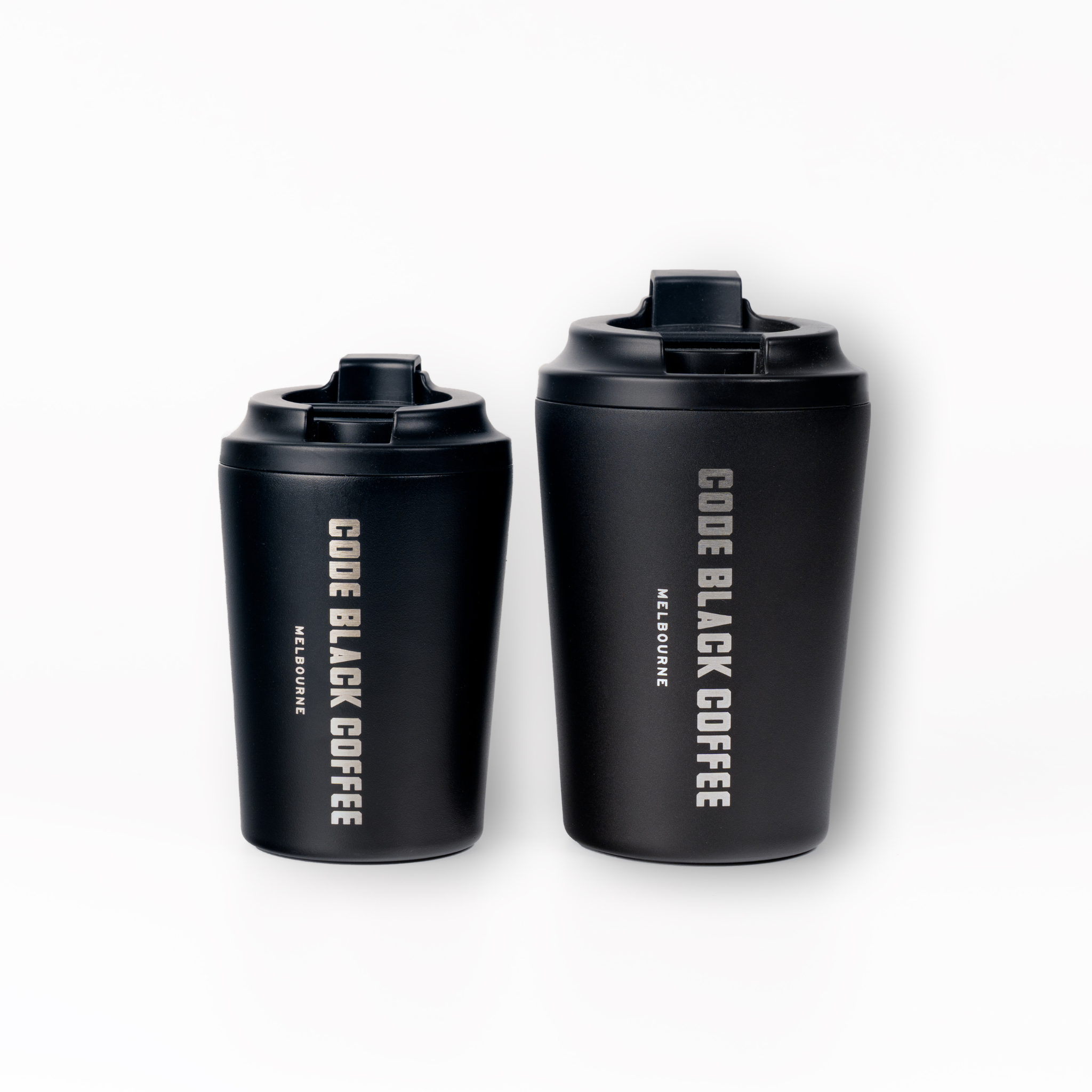 Two black Fressko coffee cups with 'Code Black Coffee Melbourne' branding on a white background